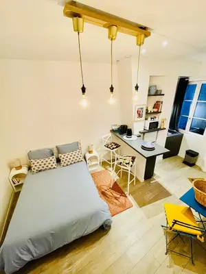 Un ou plusieurs lits dans un hébergement de l'établissement La Petite Jeannette Studio