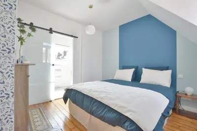 Un ou plusieurs lits dans un hébergement de l'établissement Les Chambres du 32
