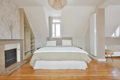 Un ou plusieurs lits dans un hébergement de l'établissement Les Chambres du 32