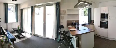 Cuisine ou kitchenette dans l'établissement Elegant Apartment in the Heart of Chantilly Just Steps from the Château