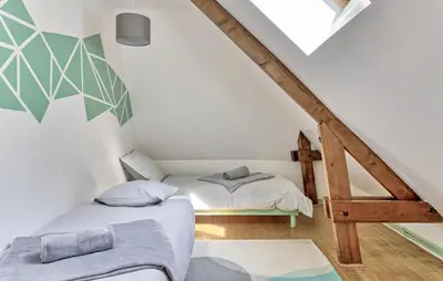 Un ou plusieurs lits dans un hébergement de l'établissement Maison Vue Campagne