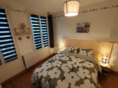 Un ou plusieurs lits dans un hébergement de l'établissement Chez Nanou location saisonnière 2 chambres