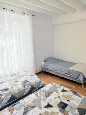 Un ou plusieurs lits dans un hébergement de l'établissement Maison authentique du Vexin