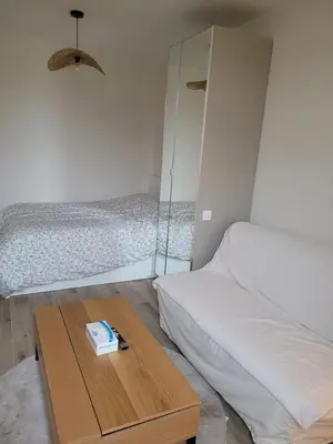 Un ou plusieurs lits dans un hébergement de l'établissement Appartement cosy 2