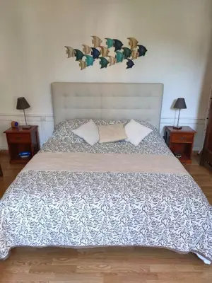 Un ou plusieurs lits dans un hébergement de l'établissement Appartement Cosy avec jardinet