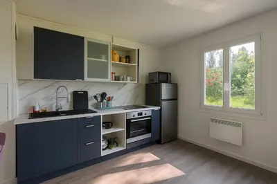 Cuisine ou kitchenette dans l'établissement Comme à la Maison - Penly