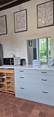 Cuisine ou kitchenette dans l'établissement Domaine de la Ferme de Tumbrel