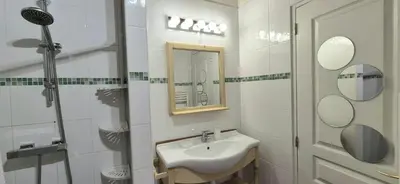 Salle de bains dans l'établissement Domaine de la Ferme de Tumbrel