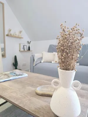 Coin salon dans l'établissement Le Petit Pontoise