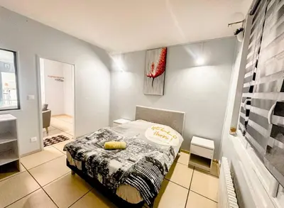 Un ou plusieurs lits dans un hébergement de l'établissement La ContrEscarpe - 4 couchages - Cour PRiVÉE - Secteur GARE CENTRE