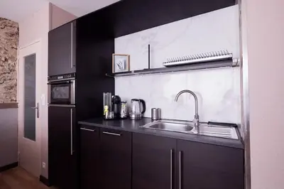 Cuisine ou kitchenette dans l'établissement T2 cosy avec parking