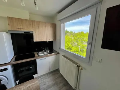 Cuisine ou kitchenette dans l'établissement La Perle