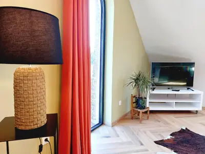 Télévision ou salle de divertissement dans l'établissement Gîte Les Jacquemarts Normands