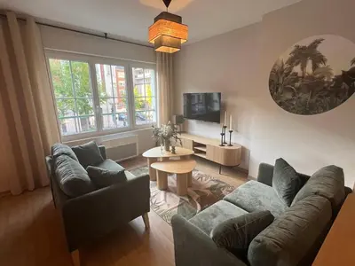 Télévision ou salle de divertissement dans l'établissement Home Design