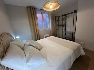 Un ou plusieurs lits dans un hébergement de l'établissement Home Design