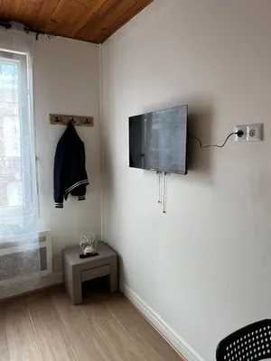 Télévision ou salle de divertissement dans l'établissement Appt 5 a deux pas de la gare