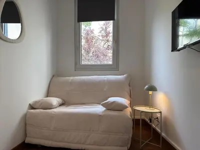Coin salon dans l'établissement Rouen Gare - Petit studio cosy - Climatisation