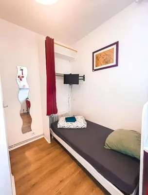 Un ou plusieurs lits dans un hébergement de l'établissement La ContrEscarpe - Studios de DEPANNAGE - Secteur GARE CENTRE