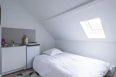 Un ou plusieurs lits dans un hébergement de l'établissement Studio moderne proche centre ville & Gare