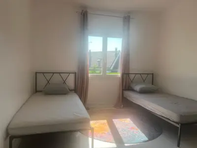 Un ou plusieurs lits dans un hébergement de l'établissement Maison Serenity Domont Retreat