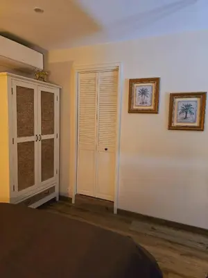 Un ou plusieurs lits dans un hébergement de l'établissement STUDIO VOYAGE COLONIAL CLIMATISE chic