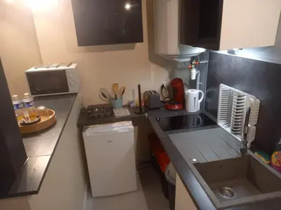 Cuisine ou kitchenette dans l'établissement Le Cocon