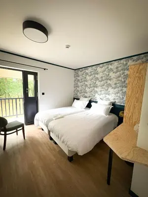 Un ou plusieurs lits dans un hébergement de l'établissement Hôtel du Golf De Jumièges