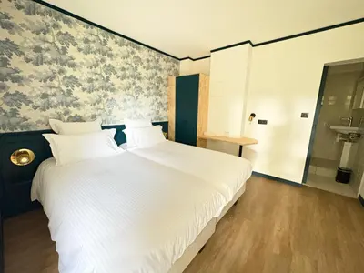 Un ou plusieurs lits dans un hébergement de l'établissement Hôtel du Golf De Jumièges