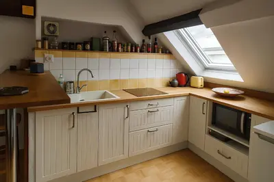 Cuisine ou kitchenette dans l'établissement Buffon Ménage et linges inclus