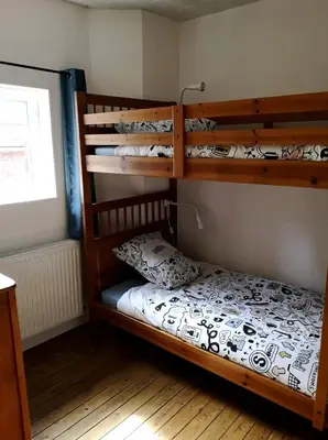 Un ou plusieurs lits dans un hébergement de l'établissement Maison de pêcheur