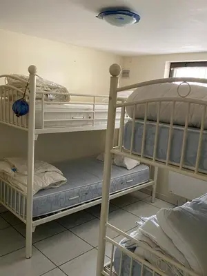 Un ou plusieurs lits dans un hébergement de l'établissement La maison du soleil