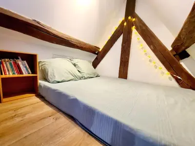 Un ou plusieurs lits dans un hébergement de l'établissement Appartement cosy & mezzanines