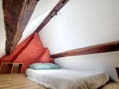 Un ou plusieurs lits dans un hébergement de l'établissement Appartement cosy & mezzanines