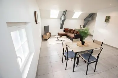 Coin salon dans l'établissement Appartement spacieux et lumineux