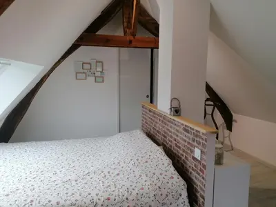 Un ou plusieurs lits dans un hébergement de l'établissement Studio cosy