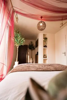Un ou plusieurs lits dans un hébergement de l'établissement Triplex Design avec Rooftop et Salle Cinéma
