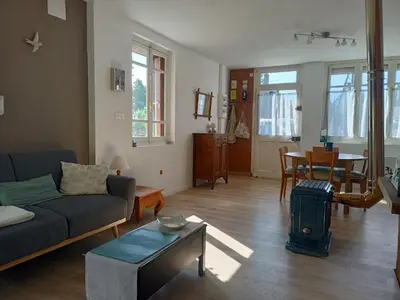 Coin salon dans l'établissement Maison De Vacances