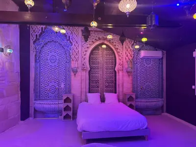 Un ou plusieurs lits dans un hébergement de l'établissement Appartement Jacuzzi Hammam 1001 Nuits Yaospa60