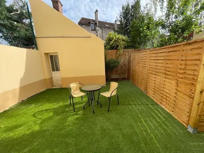 Jardin de l'établissement 2-Appartement RDC 28 m2 avec Jardin
