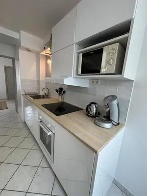 Cuisine ou kitchenette dans l'établissement Le Contemporain - 2p - wifi
