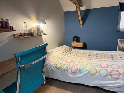 Un ou plusieurs lits dans un hébergement de l'établissement La chambre du Parc
