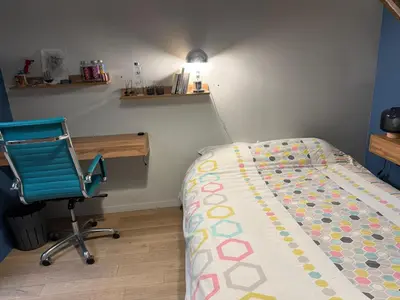 Un ou plusieurs lits dans un hébergement de l'établissement La chambre du Parc