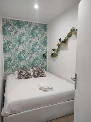 Un ou plusieurs lits dans un hébergement de l'établissement Cabane Jungle Appt 2p cosy calme Rouen fac
