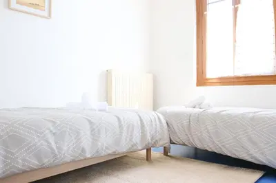 Un ou plusieurs lits dans un hébergement de l'établissement Les Géraniums vue mer - 4 personnes