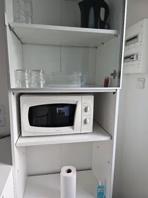 Cuisine ou kitchenette dans l'établissement Studio calme à mantes la ville