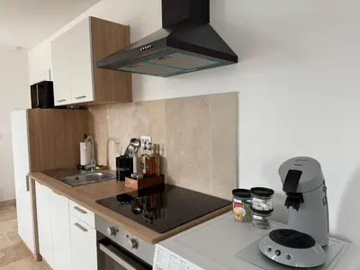 Cuisine ou kitchenette dans l'établissement Le Prestige - Spacieux T3 Neuf et Lumineux