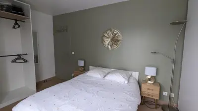 Un ou plusieurs lits dans un hébergement de l'établissement Bel appartement, proche gare, Poissy- Ouest Paris