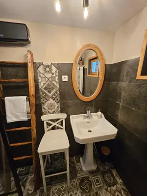 Salle de bains dans l'établissement Le clos des oiseaux