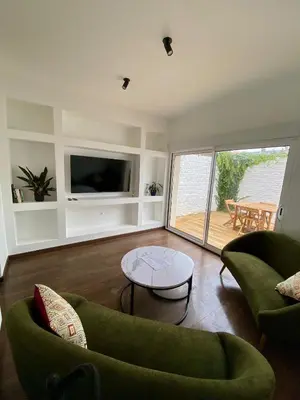 Coin salon dans l'établissement L'Amienoise Maison 2ch Confort et standing