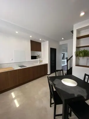 Cuisine ou kitchenette dans l'établissement L'Amienoise Maison 2ch Confort et standing